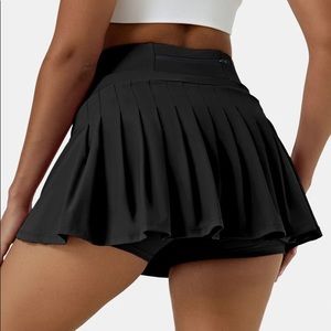 Black Tennis / golf skirt. NEVER BEEN WORN